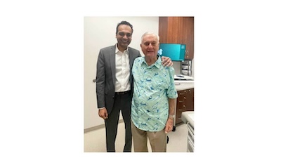 man smiling with doctor